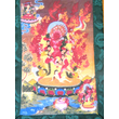 Tibeti buddhista Kurukulla tangka fotója brokát keretbe varrva