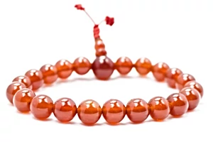 Karneol mala 21 szemes karneol guruval 16cm kerületű - piros gumival
